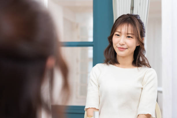 istock asian woman to see a mirror 1395994411