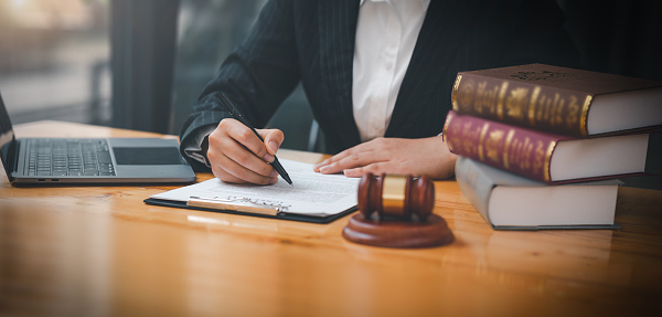 female lawyers working at the law firms. Judge gavel with scales of justice. Legal law, lawyer, advice and justice concept.