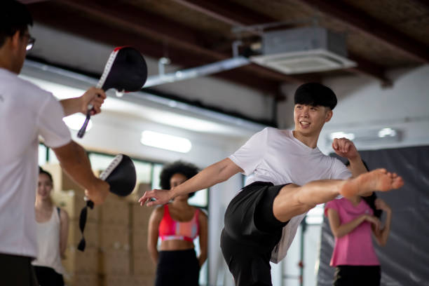 Male Chinese Asian Kickboxing training stock photo