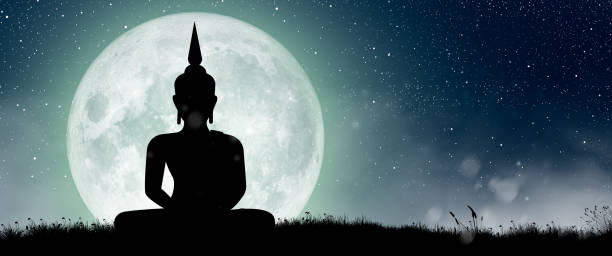 istock Silhouette of Buddha mediating with Full moon at night. Buddhist holiday Concept. 1396008564