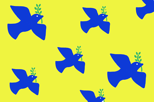 Blue peace doves on yellow background