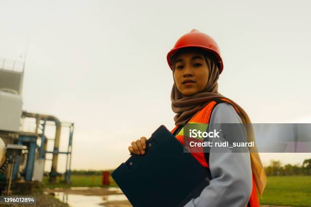 Portrait Of Young Beautiful Engineer Woman Working In Factory Building Stock Photo - Download Image Now