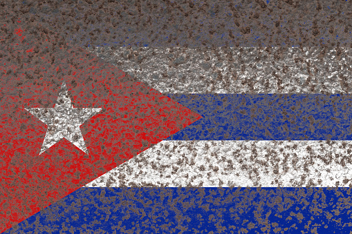 Cuba flag on a rusty old iron metal sheet
