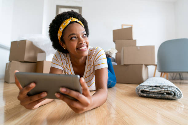 istock Pensive woman searching for ideas to decorate her house using a tablet 1396019872