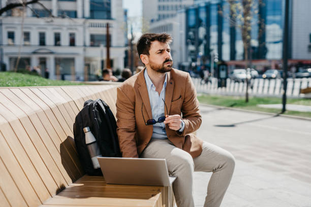 istock Businessman waiting for a public transport 1396019973