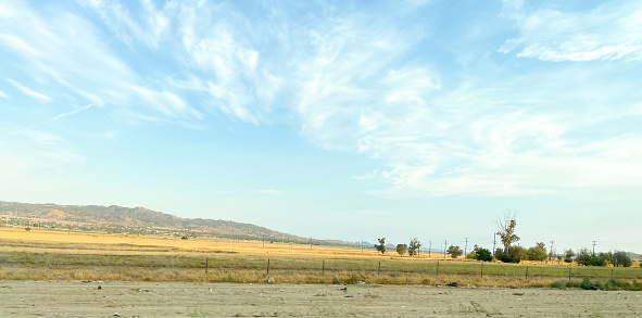 A tranquil scene plays out in Moreno Valley. The fields and mountain create a pleasant view as the sun begins to set in Southern California.
