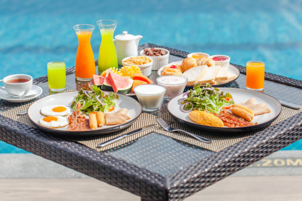 delicious breakfast in luxury hotel. vacation in resort by water in tropics - swimming pool resort swimming pool poolside sea imagens e fotografias de stock