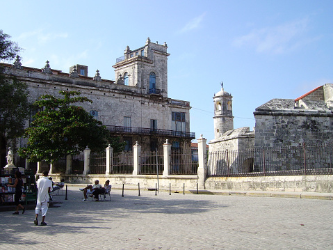 Cubans resting on the square by the ancient Castillo de la Real Fuerza in Old Havana, Cuba.