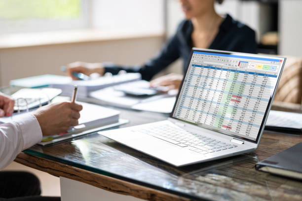 istock Female And Female Auditors Working On Computer With Invoice 1396022331