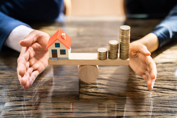 istock Real Estate House Money Equilibrium 1396024469