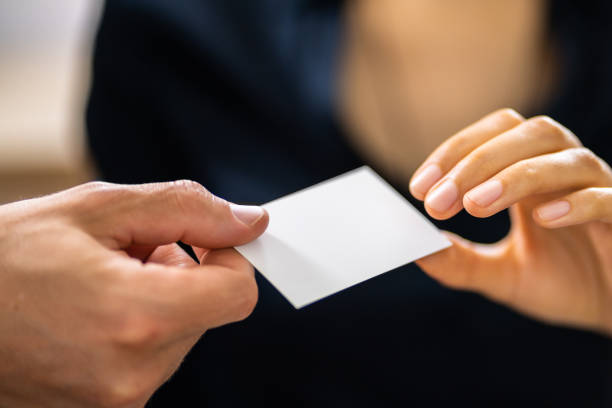 istock Person Hands Giving Visiting Card To Another Person 1396024476