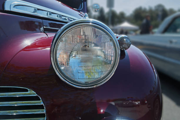 istock Headlight on on a 50's Burgundy Car 1396024608