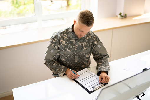 Military Student Education. Army Soldier Veteran With Computer