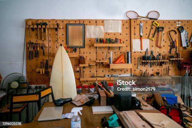 Various Carpenter Hand Tools Hanging On The Wall In The Carpentry Workshop Stock Photo - Download Image Now