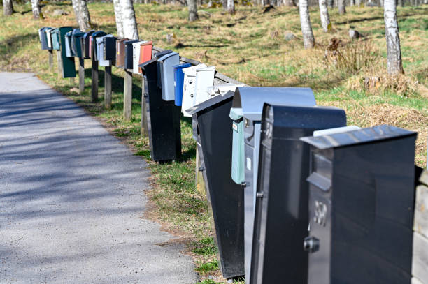 istock Row of mail boxes near tarmac road 1396025934