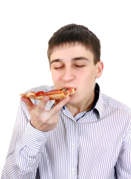 istock Teenager with Pizza 1396027808