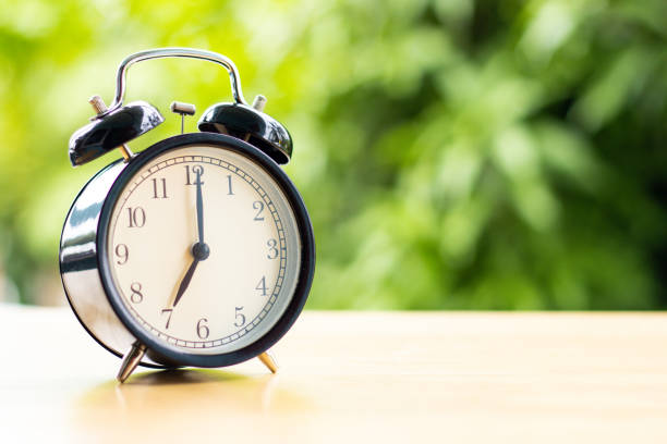 istock at 7 o'clock in the morning connect the time at for work with tree background copy space 1396033872