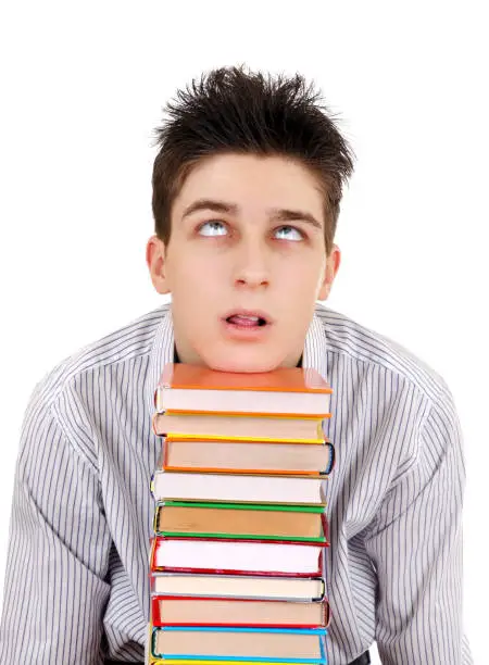 Annoyed Teenager with the Books Isolated on the White Background
