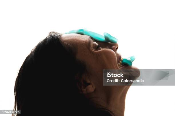 Woman With Candy Gummies On The Face Stock Photo - Download Image Now - 40-44 Years, Adult, Adults Only