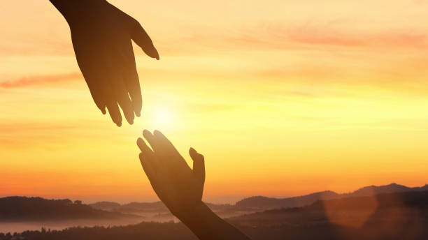 istock Silhouette of help and hope concept 1396040571