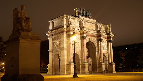 Magnificent exterior night shot of the Arc de Triomphe du Carrousel Paris, near the Louvre Museum