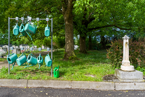 fountain and watering can at the cemetery