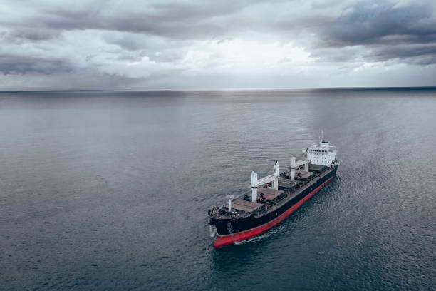 Aerial view of Large Cargo Ship Vessel entering port. Freight ship arriving port. import export logistic and export products worldwide
