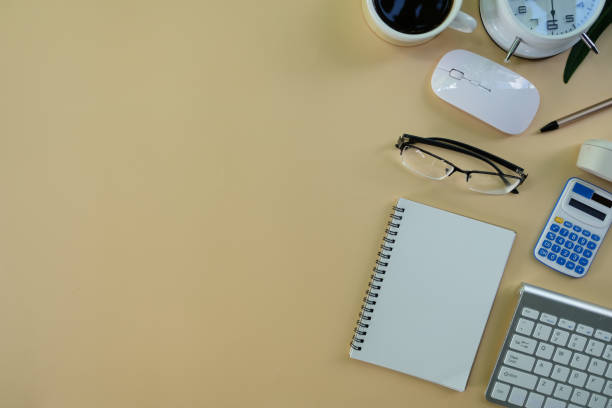 istock Coffee cup with computer keyboard on an office desk or home office table. working space 1396043056