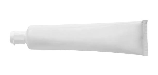 白い背景に隔離された白い歯磨き粉チューブ - dental hygiene branding packaging toothpaste ストックフォトと画像