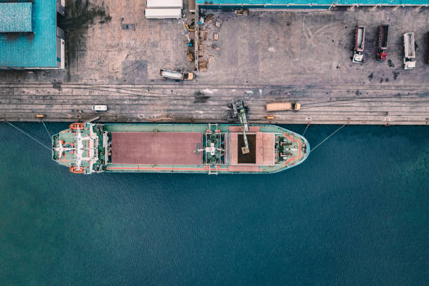 istock Aerial view of a large cargo ship unloading grain. 1396045221