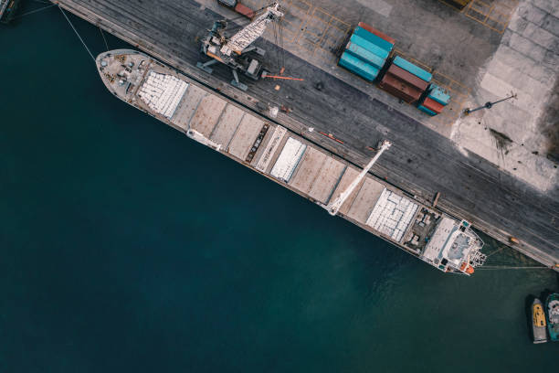 istock Aerial view of a large cargo ship unloading grain. 1396045568
