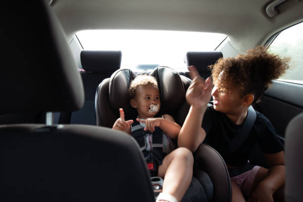 istock Children having fun on a car trip. 1396046895
