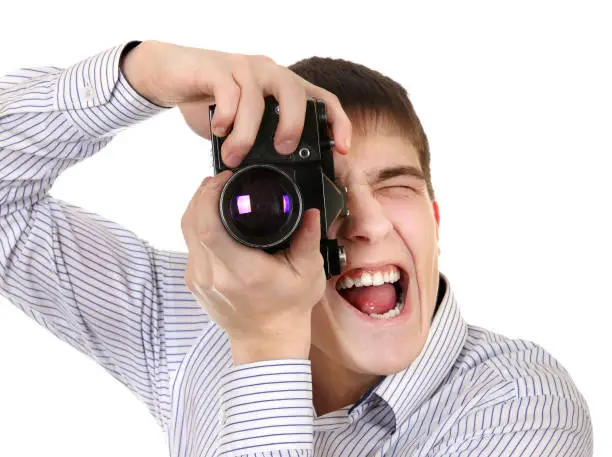 Teenager with Vintage Photo Camera Isolated on the White Background