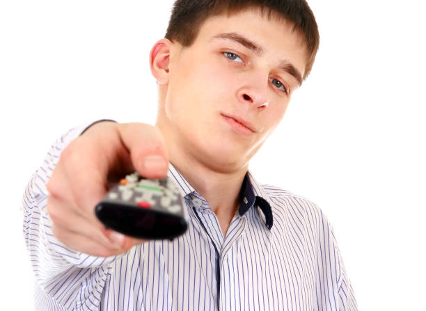 Man Using Remote Control 250+ Reaching For Remote Control Stock Photos, Pictures & Royalty-Free ...