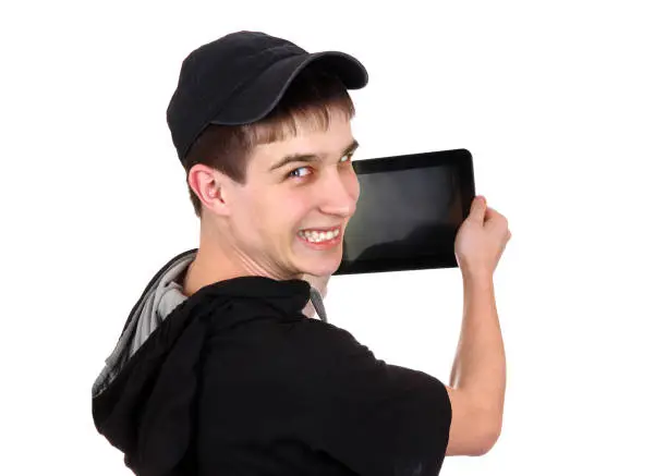 Happy Teenager with Tablet Computer Isolated on the White Background