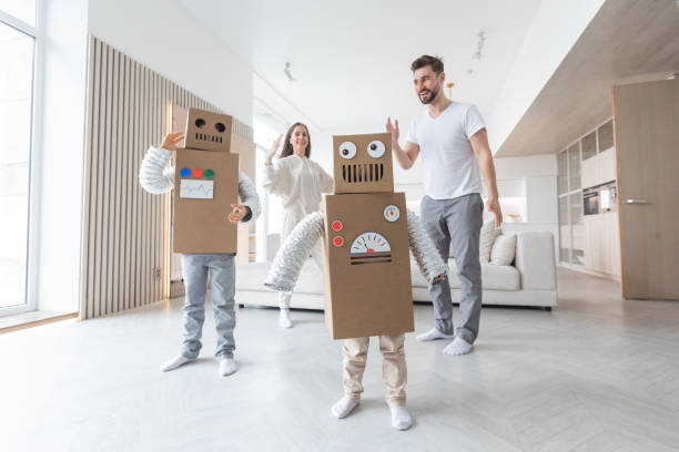istock Family playing robots at home 1396048652