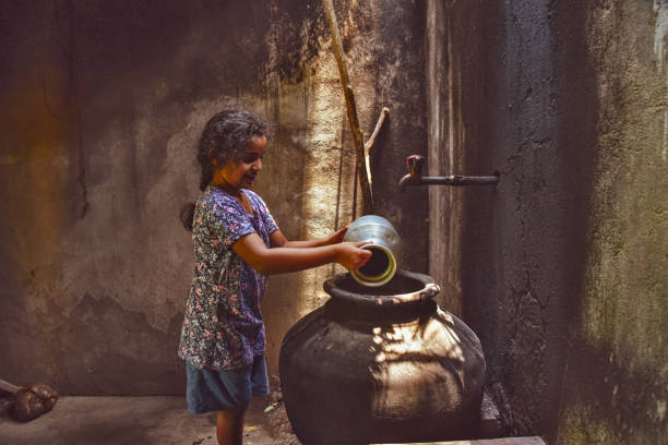 little Indian village girl carrying water, city girl enjoying rural life, grand mas house