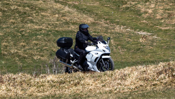 Le Markstein, France April 20, 2022 Motorcyclist on a mountain plateau on his way