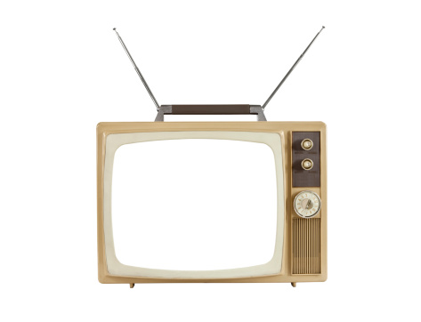 1960's blank screen portable television with antennas up.  Isolated on white.