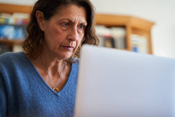 istock mature businesswoman working from home using laptop 1396054792