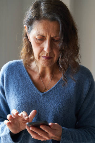istock Senior woman texting with smartphone 1396054821