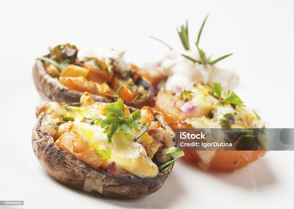 Stuffed portabello mushrooms Portabello mushrooms stuffed with tomato, cheese and cream Portobello Mushroom Stock Photo