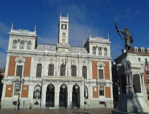 architectural details on and in front of the facade of Bilbao's city hall. The building was built in in Baroque style in 1892 by Joaquín Rucoba and is now used for official receptions and weddings.