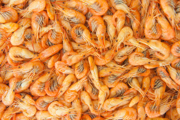 istock Cooked shrimps food background, top view 1396057858