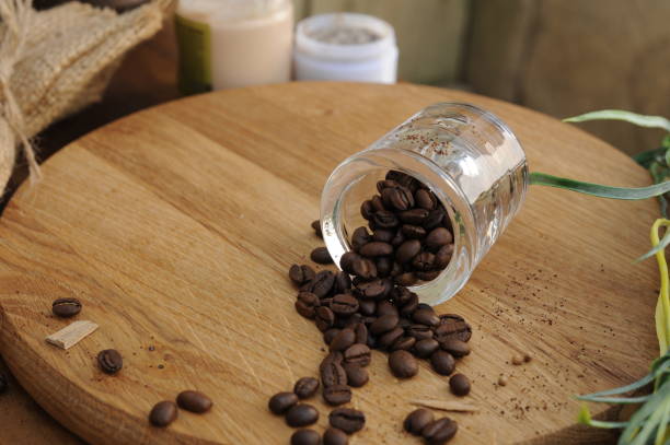 istock Whole roasted coffee beans on wooden background 1396058008