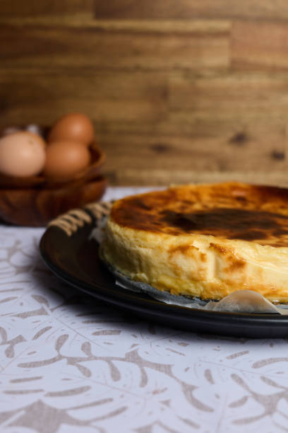 istock Creamy cheesecake on brown and white background 1396061212