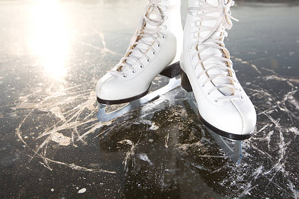 istock Wide skates on ice with sun reflected in behind 139606248