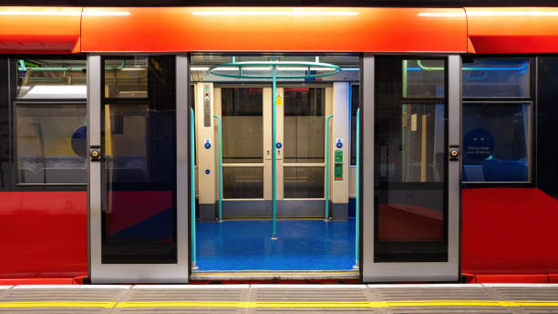 istock Generic underground train in London. Empty carriage with open doors standing at the platform. 1396062578