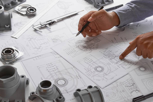 engineer technician designing drawings mechanicalâ parts engineering engine
manufacturing factory industry industrial work project blueprints measuring bearings caliper tools - vehicle part car part of ball bearing imagens e fotografias de stock