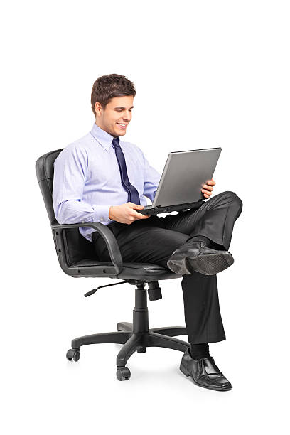 istock Young businessman sitting in office chair 139606401